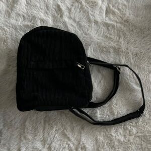 Small Garage corduroy purse back pack style.
